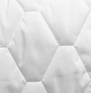 Close-up of the 1Concier Mat Pad Sleep Blueprint shows its white quilted hexagonal fabric, soft texture, and visible stitching lines, offering enhanced mattress protection.