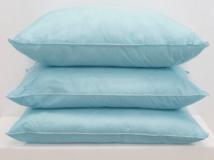 Three Pillow Fossfill - 1Concier pillows by 1Concier in light blue are stacked neatly against a plain white background.