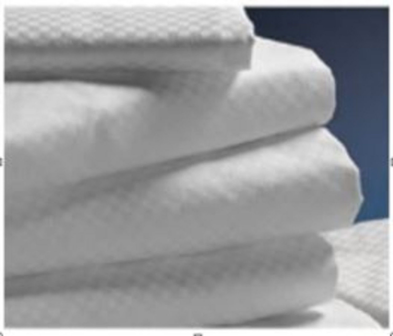 A close-up of Ganesh Mills Oxford Micro Check T300 Luxury Bed Linen flat sheets with 2 hems, featuring a subtle textured pattern—perfect for wholesale bedding needs.