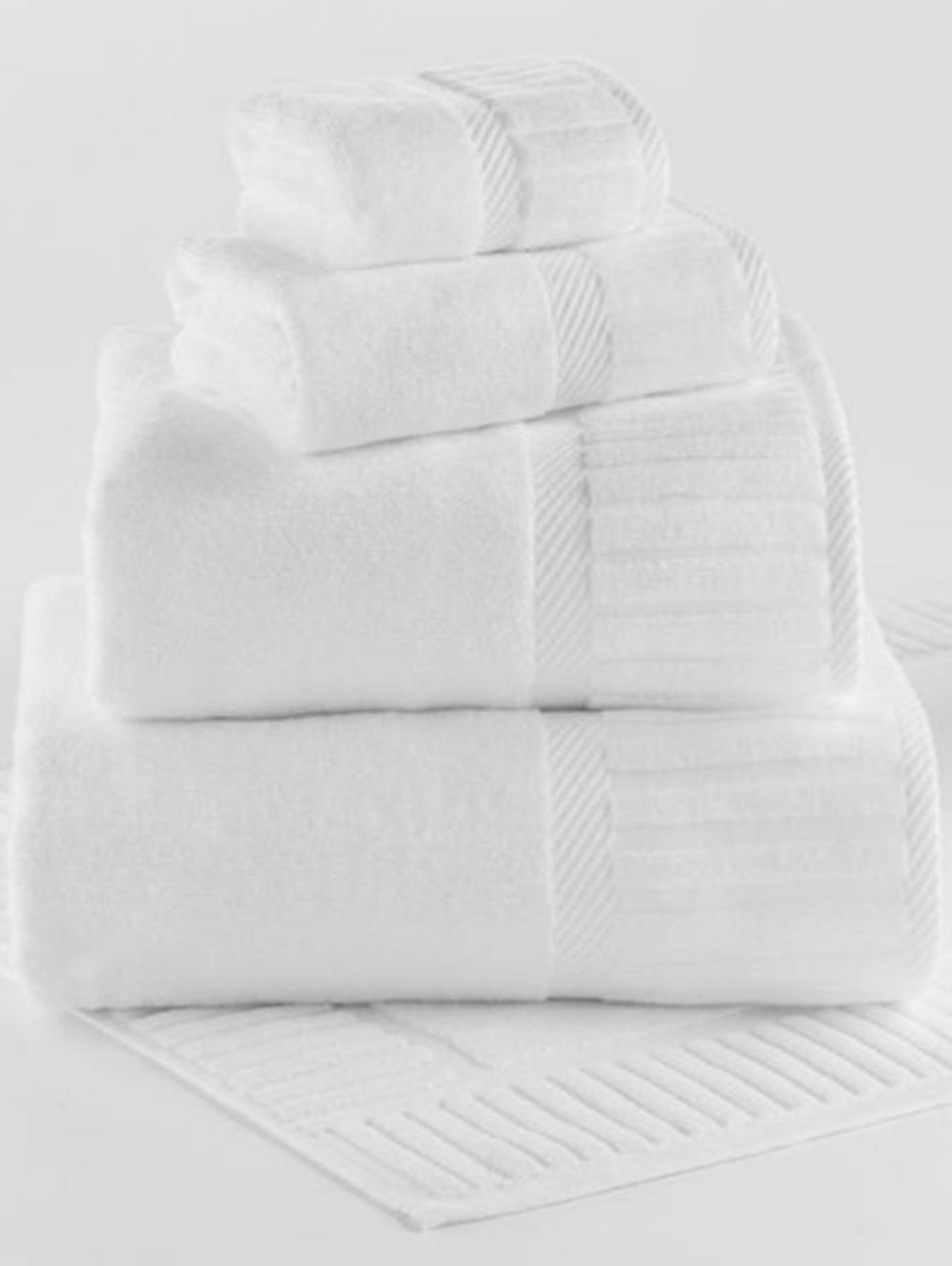 The 1Concier Bath Mat Terry Ensemble features four absorbent, combed cotton towels in various sizes with ribbed and striped edges, neatly stacked on a matching white textured bath mat, all from 1Concier.