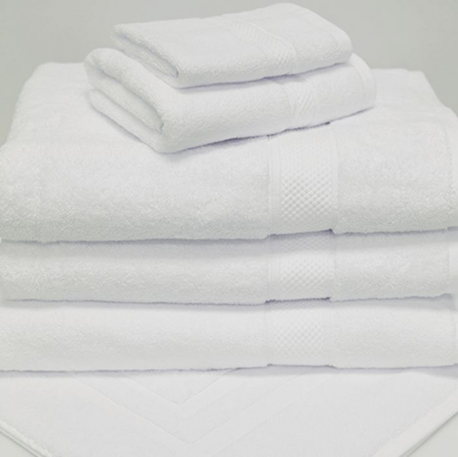 A neatly stacked set of 1Concier Bath Towel Orchid Terry Cotton/Rayon towels in various sizes is arranged on a white surface, highlighting their clean, soft texture and eco-friendly appeal.