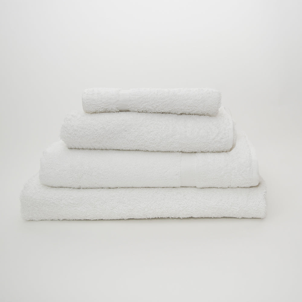 Four Everest Bath Towels by Calderon Textiles, each a different size and made from a cotton-polyester blend, are neatly stacked against a plain white background.