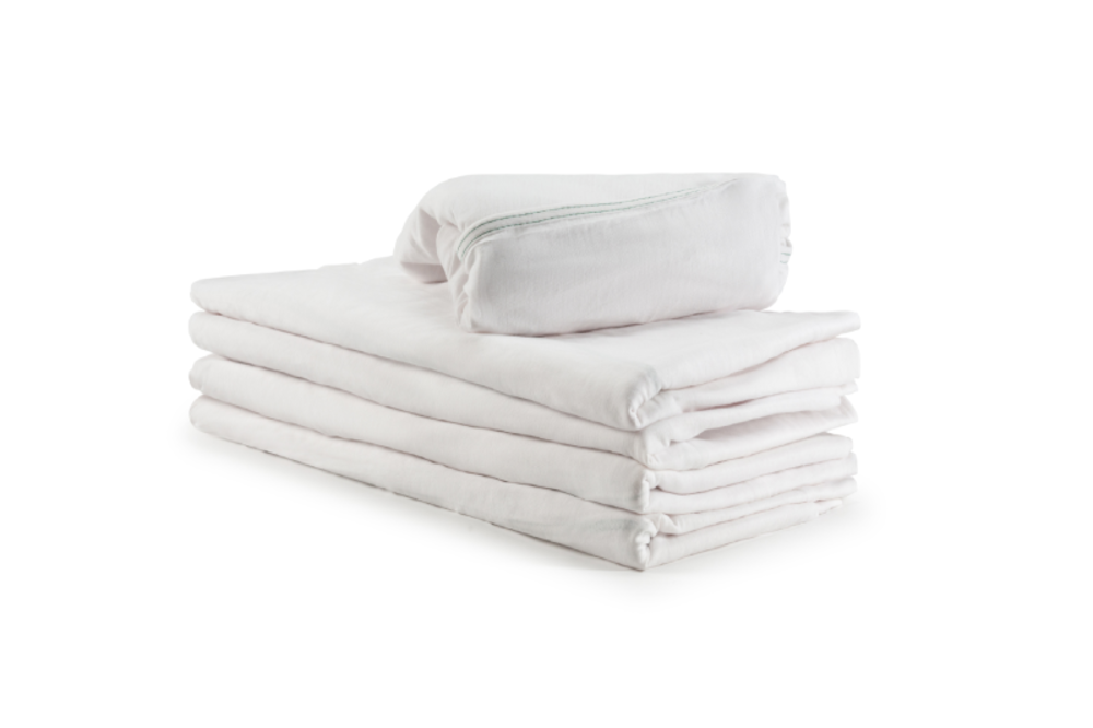A neatly folded stack of KSE Fitted Sheets - Economy T130 (Twin) with a matching white pillow on top, set against a plain white background.