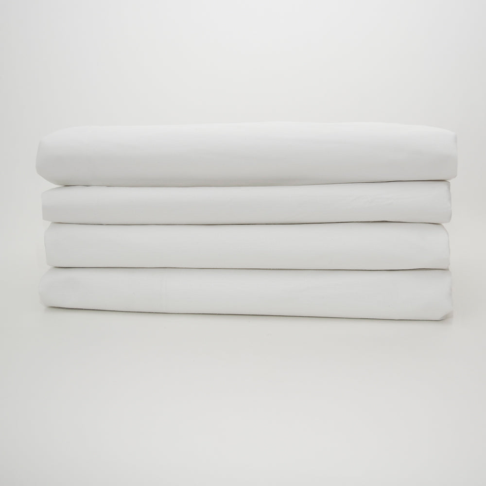 A neatly stacked set of four Calderon Textiles T-200 Full Flat XL white cotton-rich sheets, each folded and displayed on a plain white background.