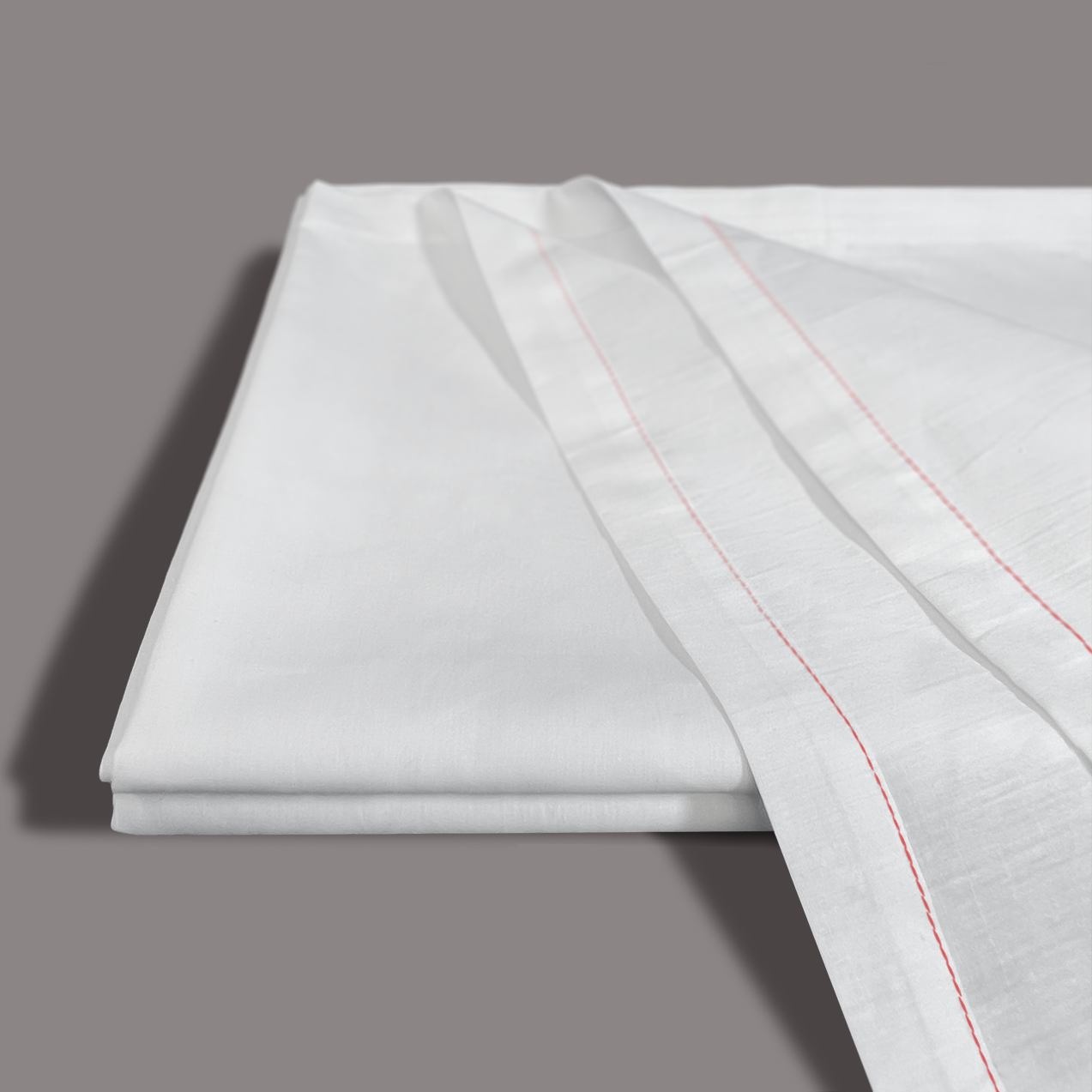 A smooth, folded Calderon Textiles T-180 Twin Drawsheet in white is shown with another sheet featuring thin, parallel red stitched lines, all set against a plain grey background.