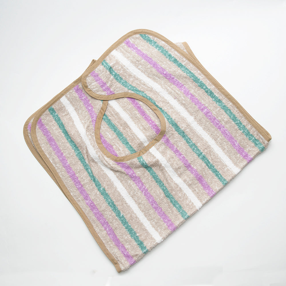 The Calderon Textiles Terry with Velcro closure is a folded bib with beige trim and green, purple, and white horizontal stripes, shown on a white background—perfect as a stylish clothing protector.