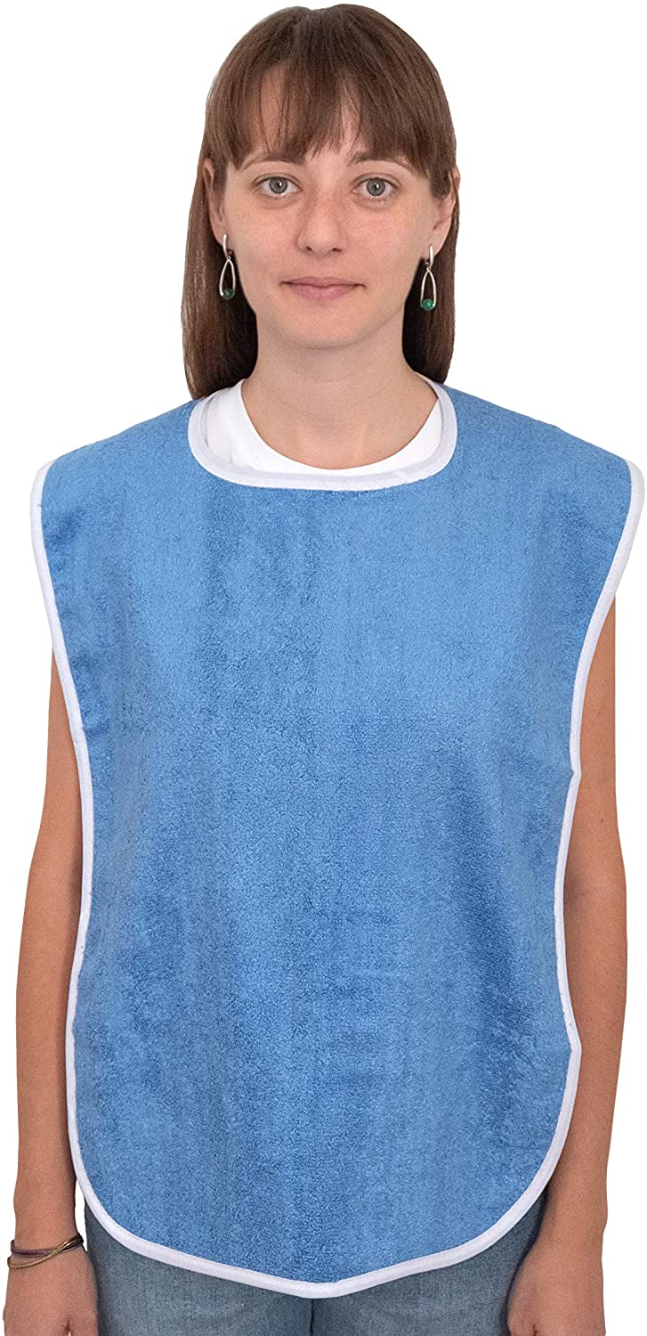A person with straight brown hair wears a blue KSE Adult Terry Bib/Clothing Protector with white trim over a white shirt, facing forward against a plain background—ideal for elderly care and effective at protecting clothing.