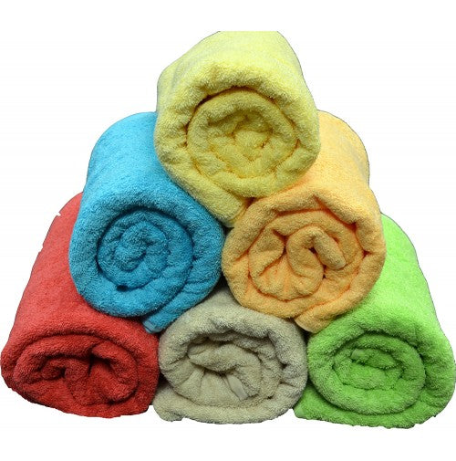 Six Ganesh Mills Oxford M5711 Premium Towels in blue, yellow, orange, red, beige, and green are stacked pyramid-style on a white background—crafted from soft ringspun cotton for a luxe touch.
